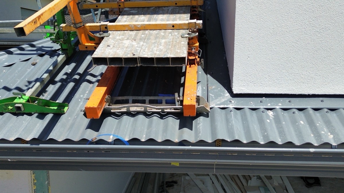 Damaged and dented roof cladding, recorded during a fixing stage inspection in Craigieburn