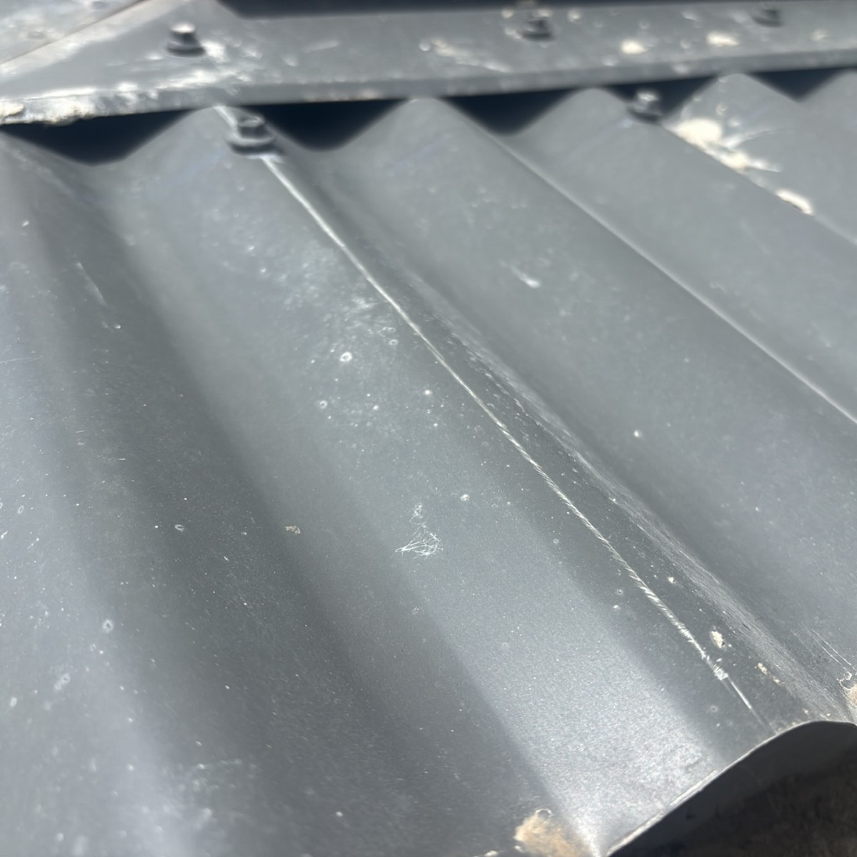 Damaged, scratched or dented roof cladding, recorded during a pre-handover inspection in Craigieburn